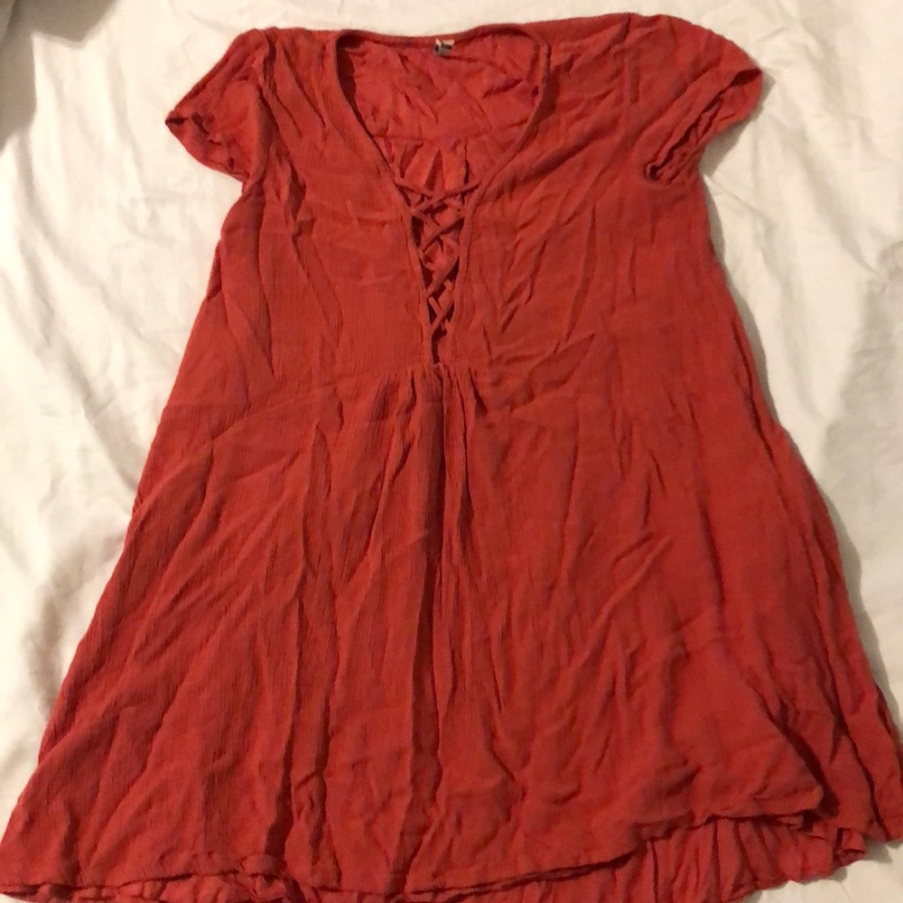 Cute lace up orangey-red babydoll styled dress